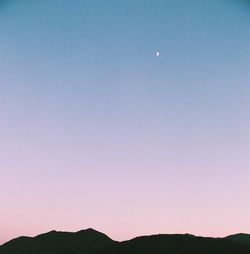 Scenic view of moon against blue sky