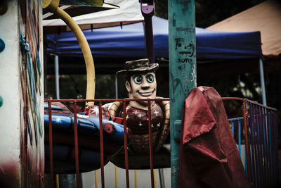 Toys hanging on metal railing
