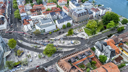 High angle view of street amidst trees in city