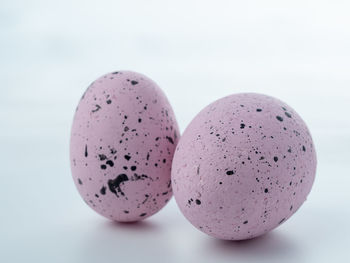 Close-up of eggs on white background