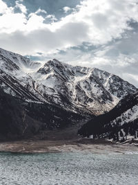 Scenic view of snowcapped mountains against sky