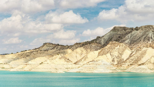 Panoramic view of sea and mountain against sky