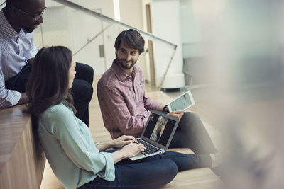 Business people having a video conference on laptop