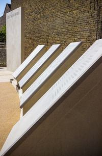 High angle view of bench against building