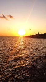 Scenic view of sunset over sea