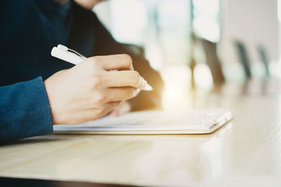 Close-up of man using mobile phone