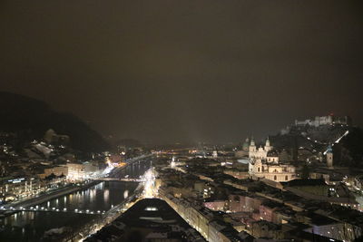 High angle view of illuminated buildings in city at night