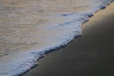 High angle view of surf on beach