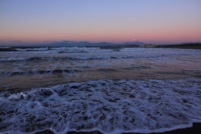 Scenic view of sea at sunset