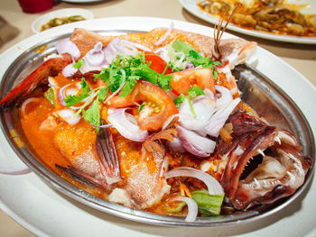 Close-up of fish served in plate on table