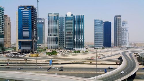 Modern buildings in city against sky