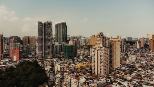High angle view of buildings in city against sky