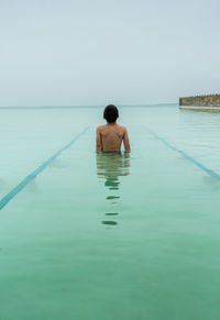 Boy standing in water