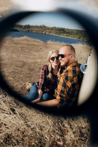 Young couple sitting on floor