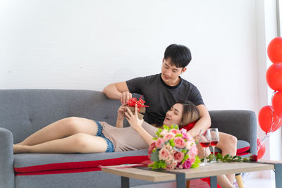 High angle view of men sitting on table