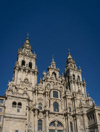 Low angle view of building against blue sky