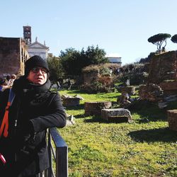 Portrait of man standing against sky