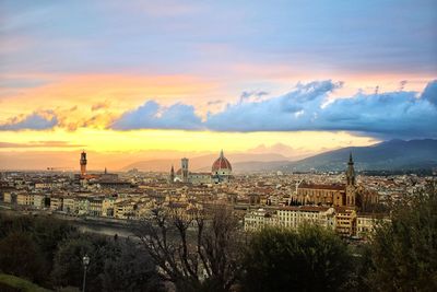 View of townscape against sky during sunset