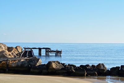 Scenic view of sea against clear blue sky