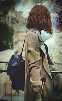 Rear view of woman standing outdoors