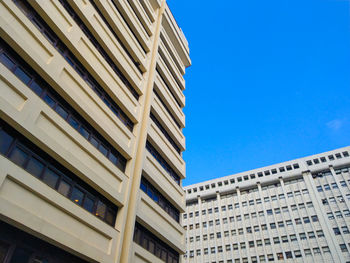Low angle view of building against blue sky