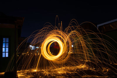 Light trails in sky at night