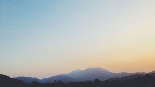 Scenic view of mountains at sunset