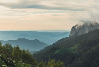 Scenic view of mountains against sky during sunset