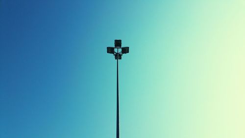 Low angle view of street light against clear blue sky