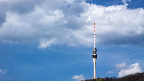 Low angle view of communications tower against sky