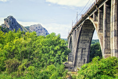 View of arch bridge against sky