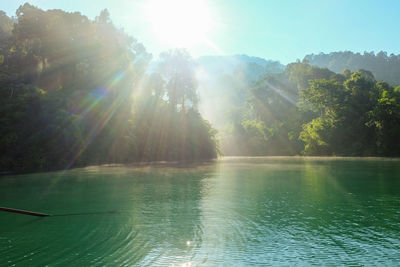 Scenic view of lake against sky on sunny day