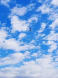 Low angle view of airplane flying in sky