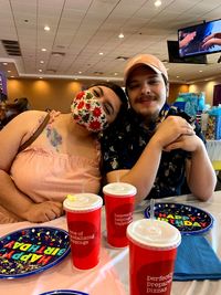 Young couple sitting on table