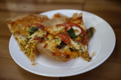 High angle view of pizza in plate on table