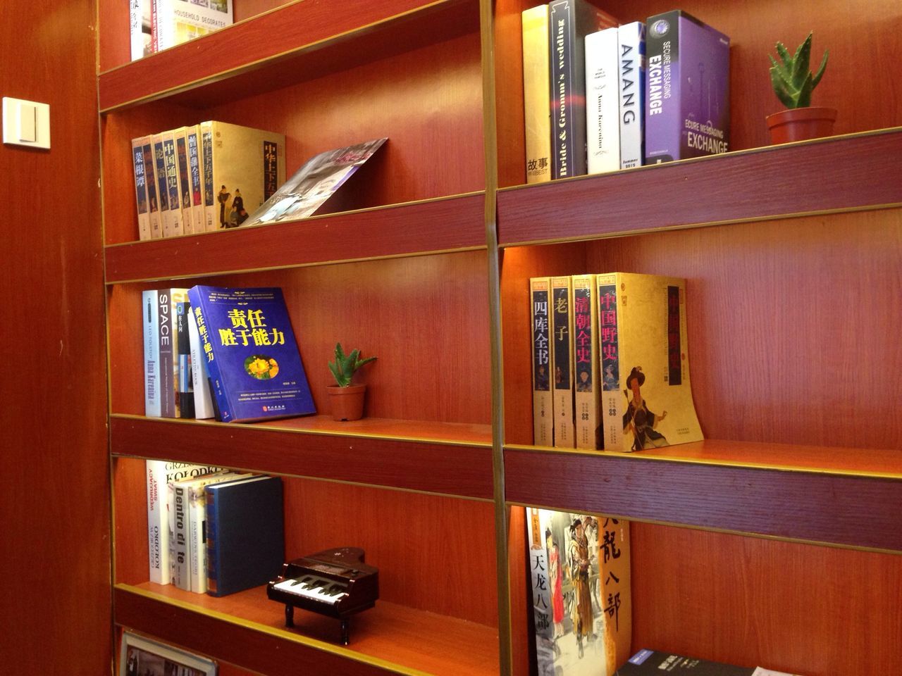 indoors, architecture, built structure, book, variation, multi colored, window, shelf, education, house, building exterior, wood - material, table, no people, text, home interior, choice, balcony, day, bookshelf