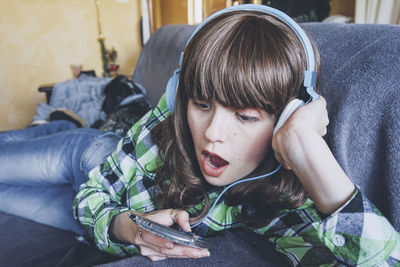 Portrait of teenage girl using mobile phone