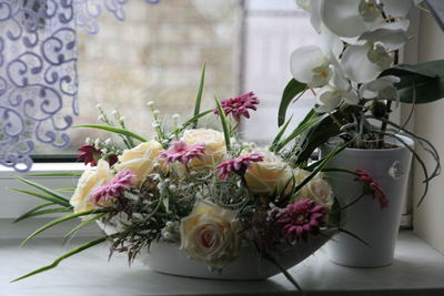 Close-up of flower vase on table