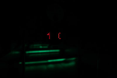 Illuminated red light in car at night