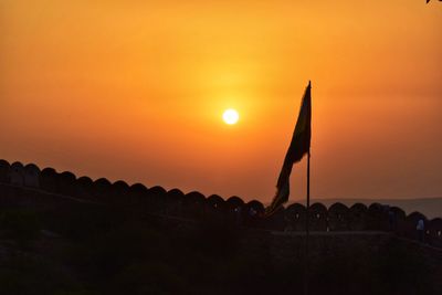 Scenic view of silhouette land against sky during sunset