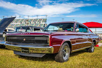 View of vintage car against cloudy sky