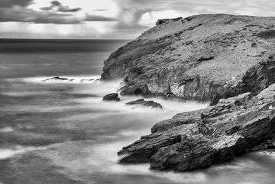 Scenic view of sea against cloudy sky