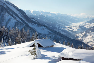 Trail to the snow covered mountain hut. winter landscape in a fabulous location