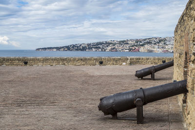 Guns in castle dell'ovo with gulf of napoli in background