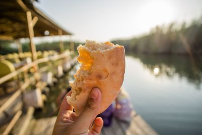 Close-up of woman holding bread