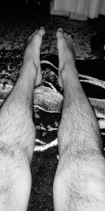 Low section of man legs on floor