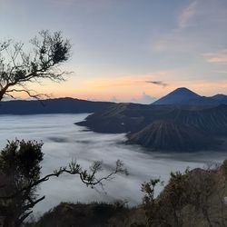 Scenic view of mountains against sky during sunrise