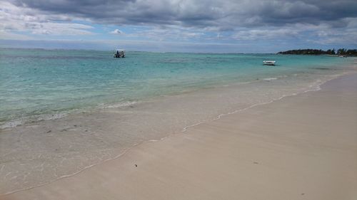 Scenic view of beach against sky