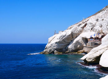 Scenic view of sea against clear blue sky