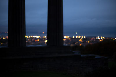 Defocused image of illuminated city at night